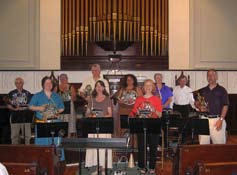 Pam and Amy Beach (impersonated by a chorus member) in a panel discussion before the performance of Weaving the World